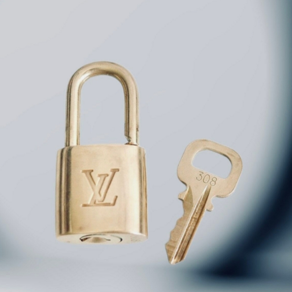 Authentic Louis Vuitton vintage gold brass lock and key set